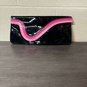 Women’s black and pink clutch bag